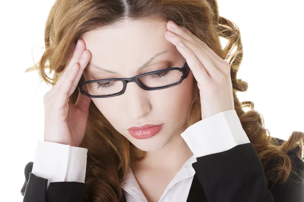 Businesswoman with a headache holding head — Stock Photo, Image
