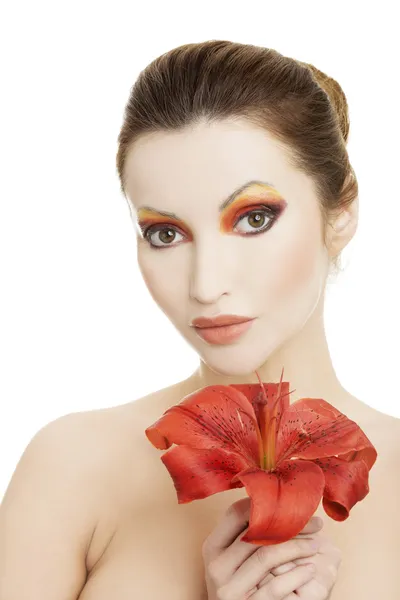 Beautiful woman with a red lily — Stock Photo, Image