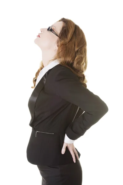 Geschäftsfrau mit Rückenschmerzen. — Stockfoto