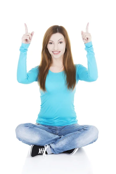 Happy , excited young woman pointing on copy space — Stock Photo, Image