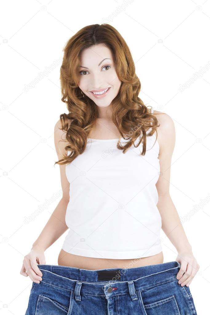 Happy fit woman with big pants