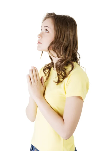 Young pretty caucasian girl praying — Stock Photo, Image