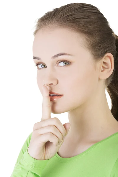 Silencio, mujer tranquila, aislada. Adolescente chica con el dedo en los labios . —  Fotos de Stock