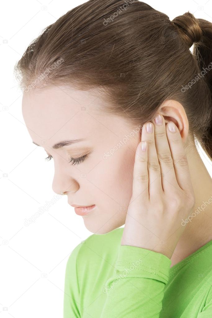Young woman feeling a pain in ear