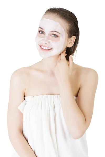 Beautiful woman with clay facial mask — Stock Photo, Image