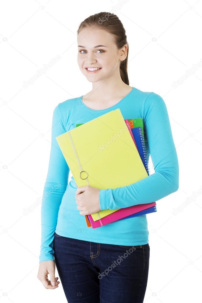 Happy student woman with notebooks