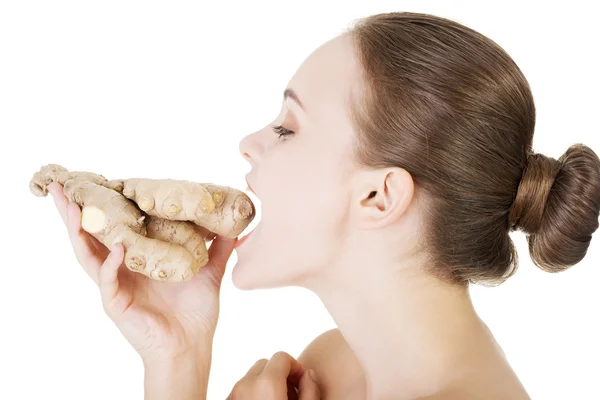 Beautiful woman with fresh ginger — Stock Photo, Image