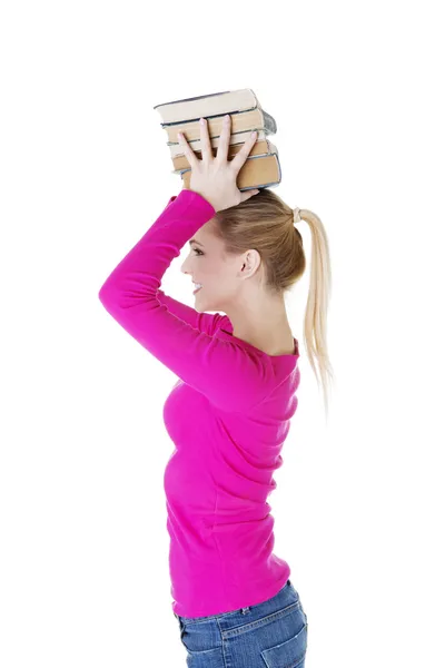 Mulher (estudante) com livreto na cabeça — Fotografia de Stock