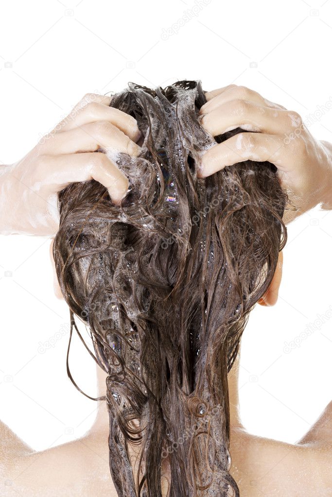 Young woman in shower washing her hairs
