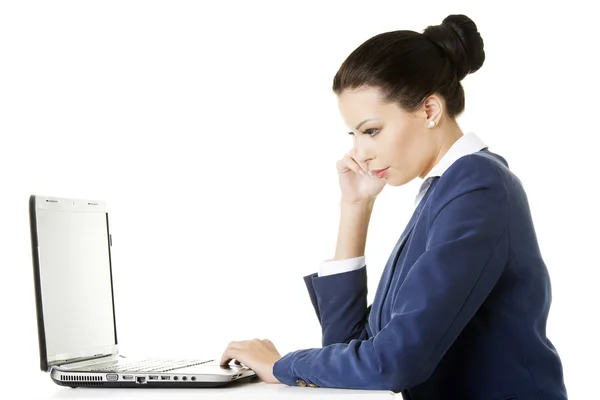 Beautiful brunette businesswoman working on laptop Royalty Free Stock Photos