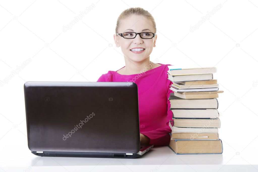 Happy student girl learning with laptop