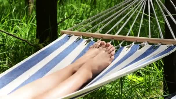Woman lying in a hammock — Stock Video