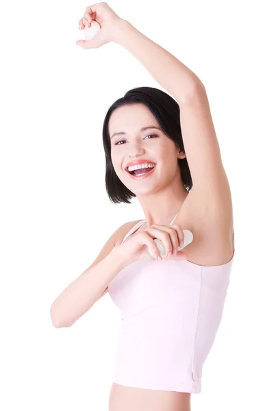 Beautiful young woman using antiperspirant — Stock Photo, Image
