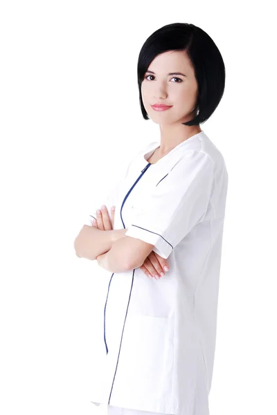 Enfermeira ou jovem médico de pé sorrindo . — Fotografia de Stock