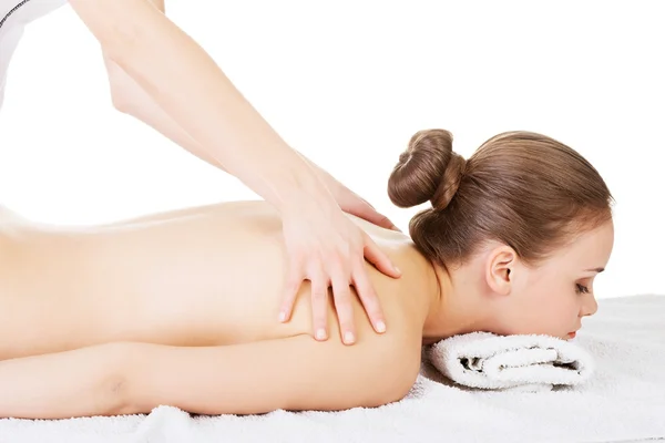 Preaty young woman relaxing beeing massaged in spa saloon — Stock Photo, Image