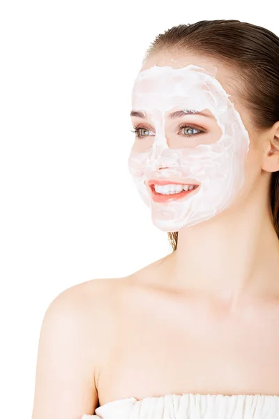 Beautiful woman with clay facial mask — Stock Photo, Image