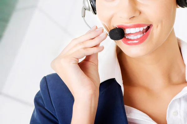 Pretty call-centre assistant smiling — Stock Photo, Image