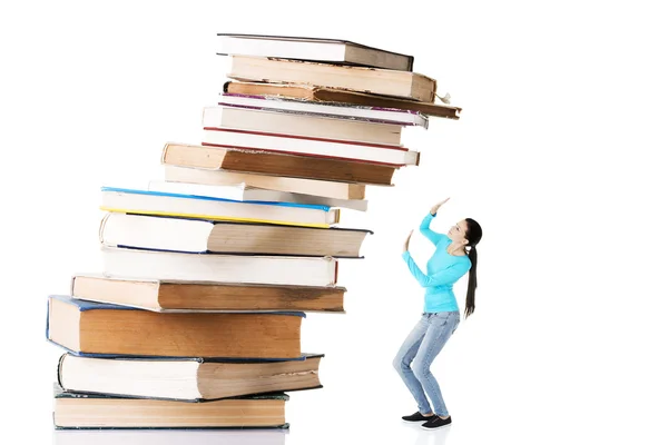Student woman afraid of pile of books. — Stock Photo, Image