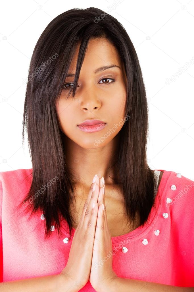 Young pretty girl praying