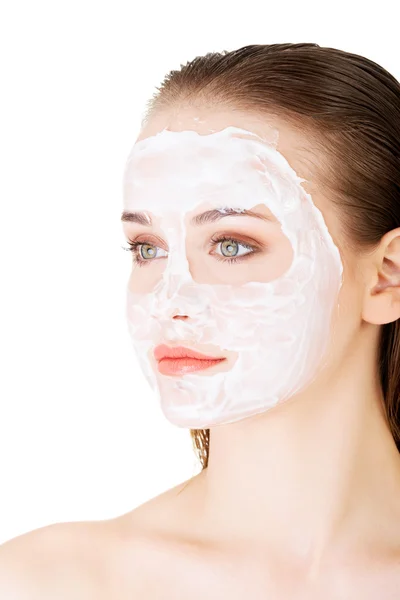 Beautiful woman with clay facial mask — Stock Photo, Image