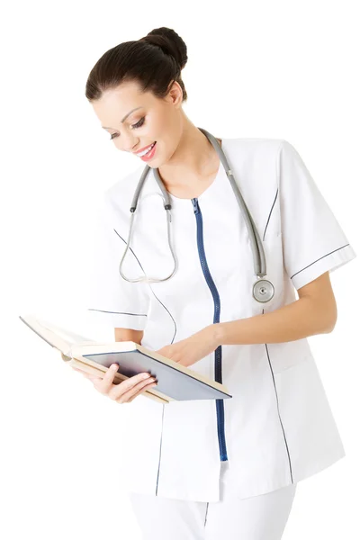 Attractive medicine student or doctor with book — Stock Photo, Image