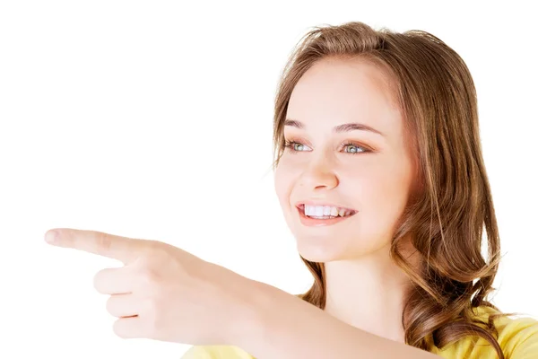 Happy , excited young woman pointing on copy space — Stock Photo, Image