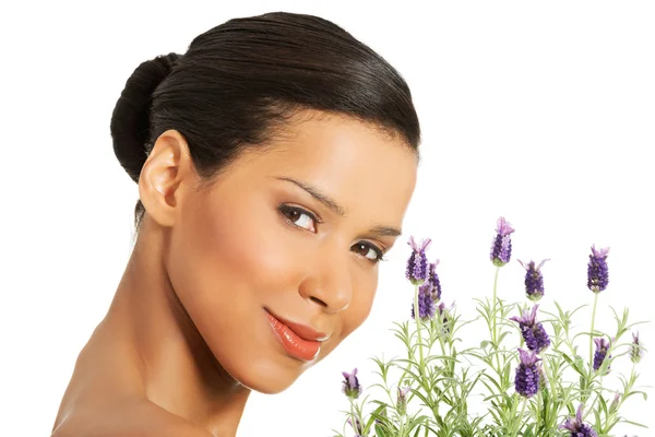 Beautiful girl smell lavender flowers — Stock Photo, Image