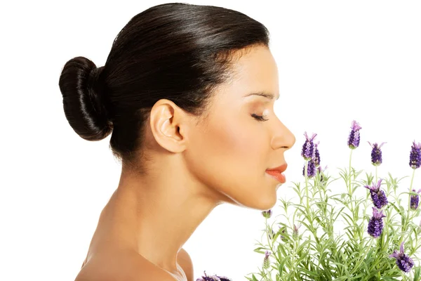 Beautiful girl smell lavender flowers — Stock Photo, Image