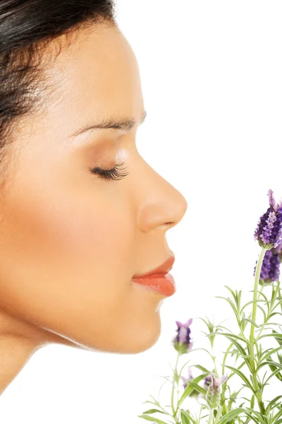 Beautiful girl smell lavender flowers — Stock Photo, Image