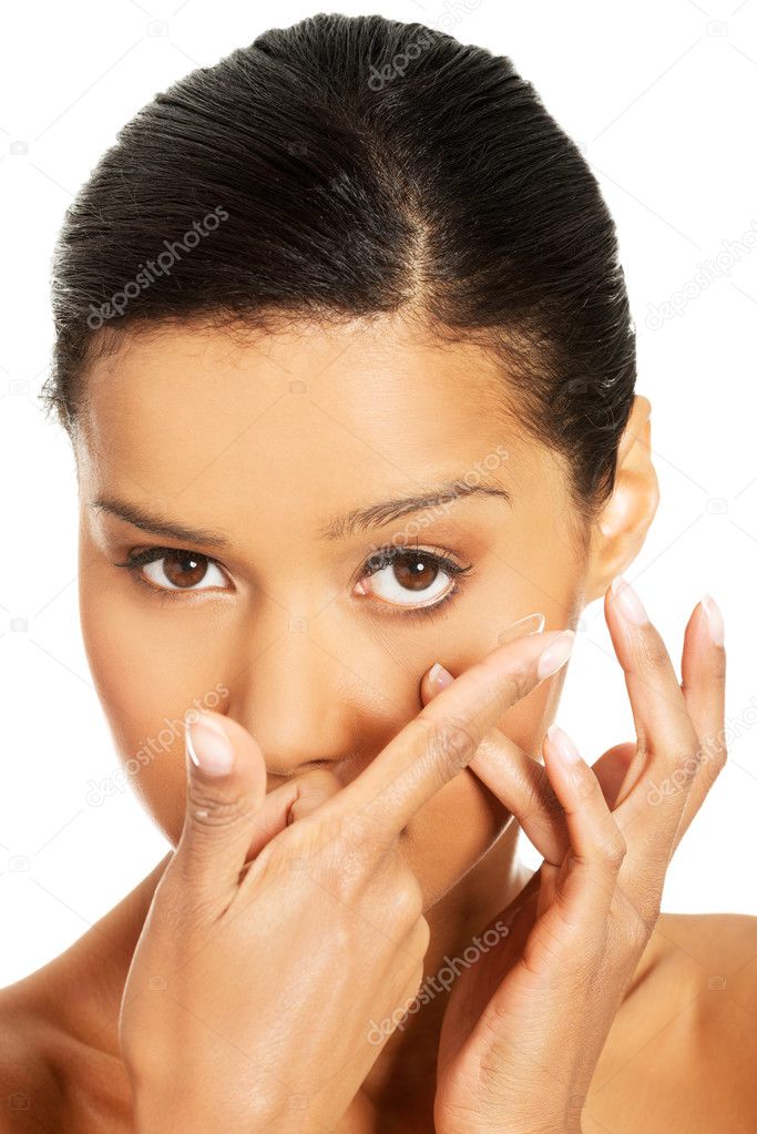 Close up of a woman putting contact lens