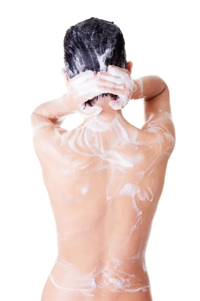 Young woman in shower washing her body — Stock Photo, Image