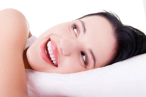 Happy sensual young woman lying in bed — Stock Photo, Image