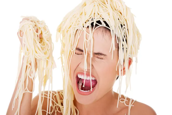 Young beautiful woman with spaghetti noodles — Stock Photo, Image