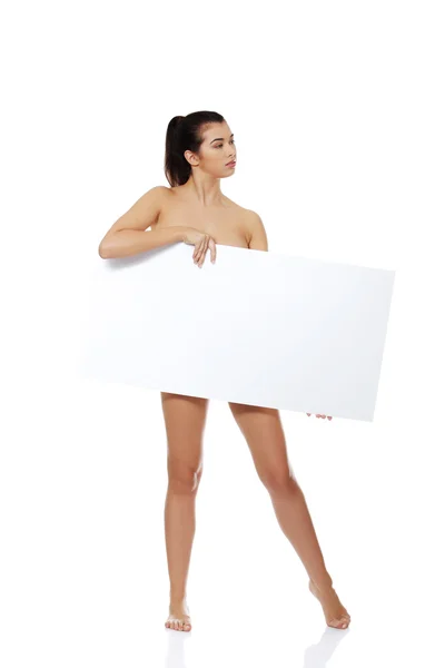 Seksi çıplak esmer boş tahta holding — Stok fotoğraf