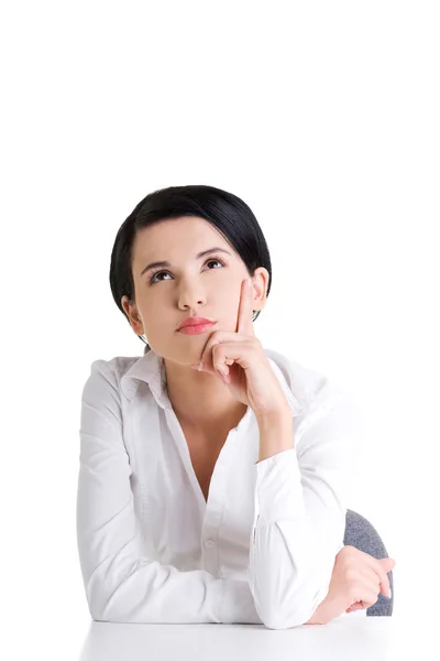Pretty young woman in sitting at the desk — Stock Photo, Image