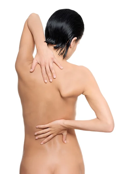 Young woman with pain in her back. Royalty Free Stock Photos
