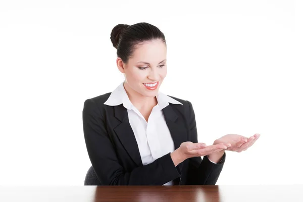 Business woman showing copy space on her palm — Stock Photo, Image