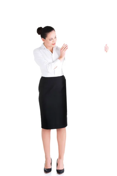 Attractive businesswoman holding blank board. — Stock Photo, Image