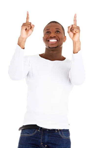 Happy young man pointing at something — Stock Photo, Image