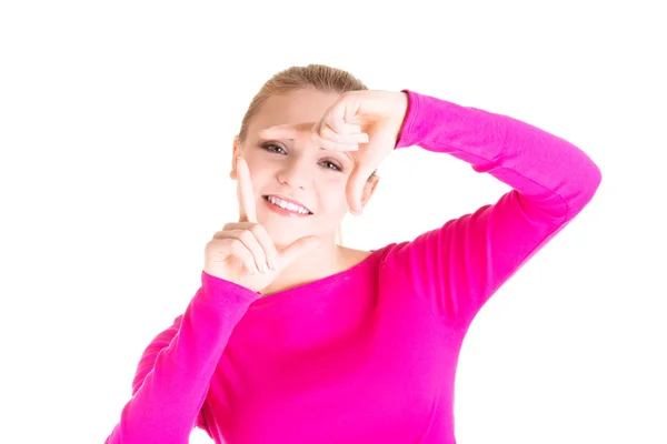 Mujer sonriente está mostrando cuadro a mano. —  Fotos de Stock