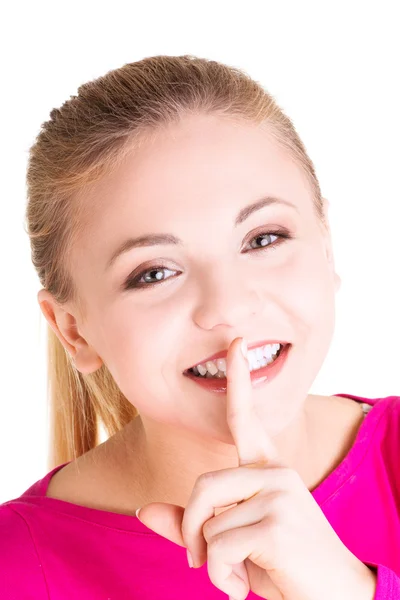 Teen girl with finger on her lips. — Stock Photo, Image