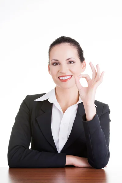 Young woman at the desk gesturing perfect Royalty Free Stock Photos