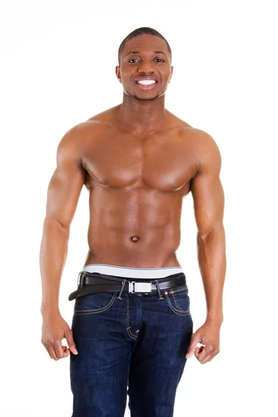 Happy well-built muscular black man in jeans Stock Photo