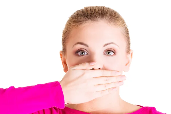 Young woman covering her mouth Stock Image