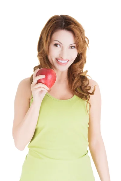Piękna kobieta z czerwonym jabłkiem. — Zdjęcie stockowe