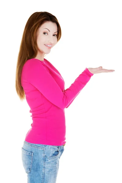 Woman presenting copy space on her palm — Stock Photo, Image