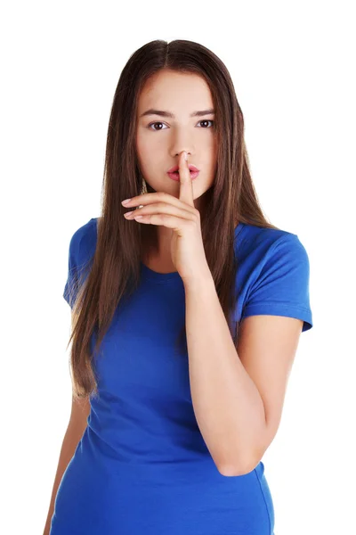 Adolescente chica con el dedo en los labios . — Foto de Stock