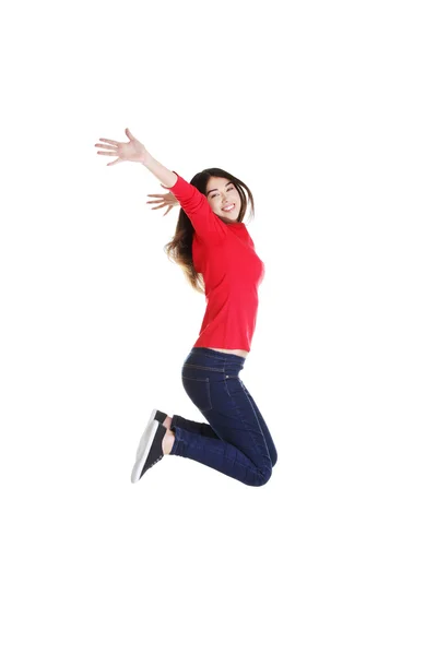Happy caucasian woman jumping in the air — Stock Photo, Image