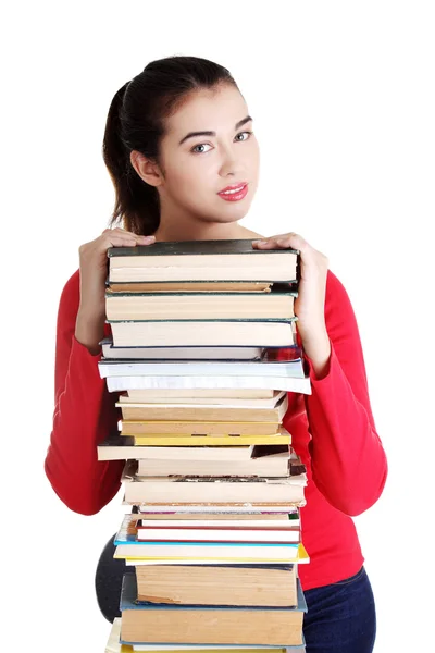 Glückliche junge Studentin mit Büchern — Stockfoto