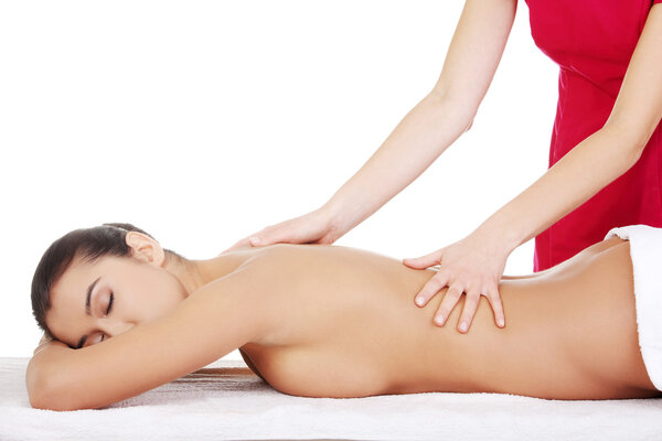 Young woman relaxing beeing massaged